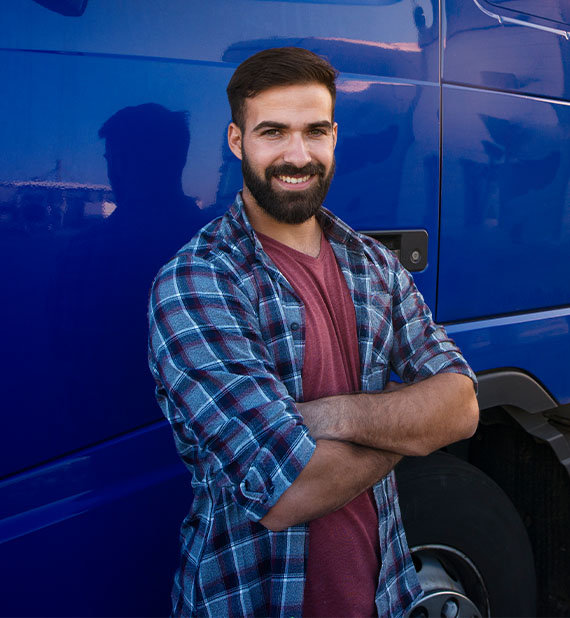 Professional truck driver with crossed arms